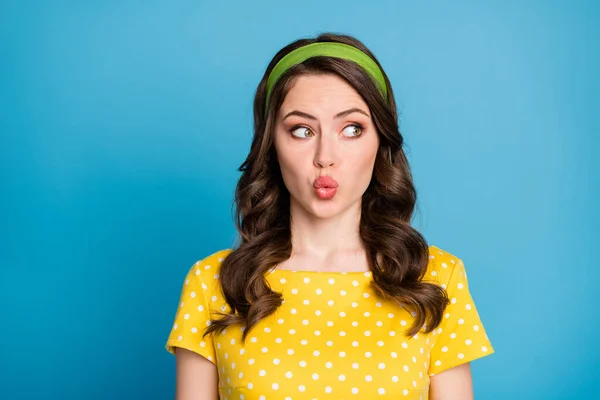 Photo of astonished cute young girl look empty space with lips pouted isolated over blue color background — Stock Photo, Image