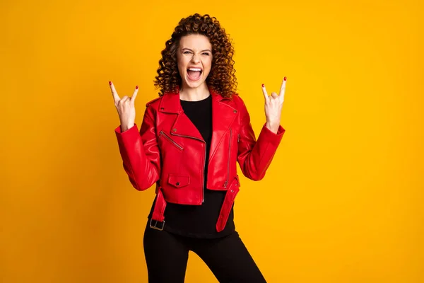 Portrait of her she nice attractive cool crazy overjoyed cheerful wavy-haired girl showing horn symbol isolated over bright yellow color background — Stock Photo, Image