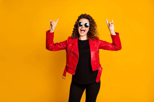 Portrait of her she nice attractive cheerful crazy cool wavy-haired girl showing two horn symbol having fun isolated on bright yellow color background — Stock Photo, Image