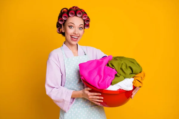 Photo of excited girl heap dirty clothes hold wear bath robe isolated bright shine color background — Stock Photo, Image