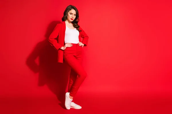 Full body photo of magnificent lovely shiny lady put hands on waist isolated over bright red color background — Stock Photo, Image