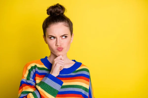 Photo of pretty bun hairstyle person arm on chin look empty space decision wear pullover isolated on yellow color background — Stock Photo, Image