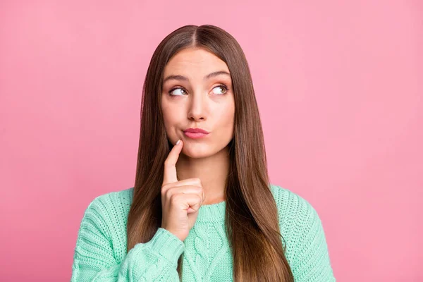 Close up portrait of attractive lady look empty space finger on chin turquoise pullover isolated on pink color background — Stock Photo, Image