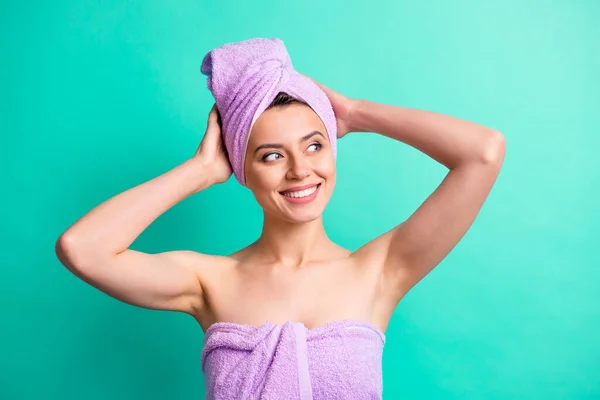 Photo portrait of curious girl in pink towel making turban on head spa smiling looking at copyspace isolated on vibrant turquoise color background — Stock Photo, Image