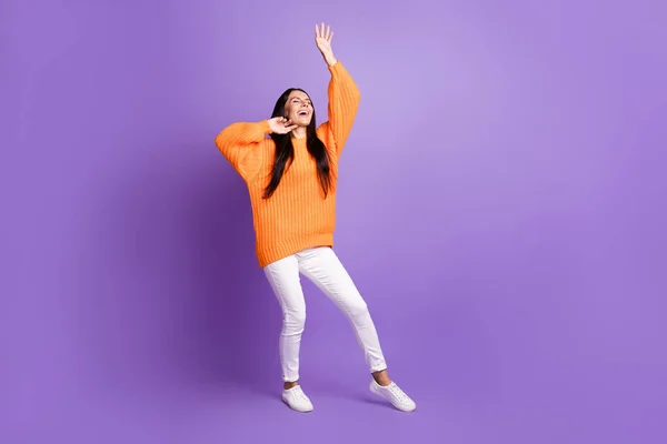 Full size photo of optimistic cute girl dancing sing wear red sweater trousers sneakers isolated on lilac background — Stock Photo, Image