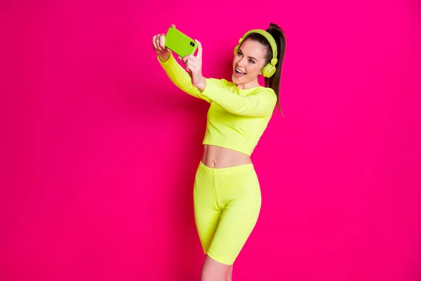 Portrait of her she nice attractive pretty lovely cheerful cheery girl listening music pop melody making taking selfie having fun isolated bright vivid shine vibrant pink fuchsia color background — Stock Photo, Image