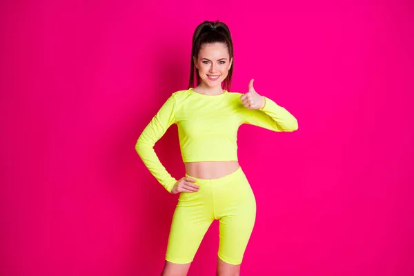 Photo of shiny pretty lady wear sport outfit showing thumb up hand arm waist isolated pink color background — Stock Photo, Image