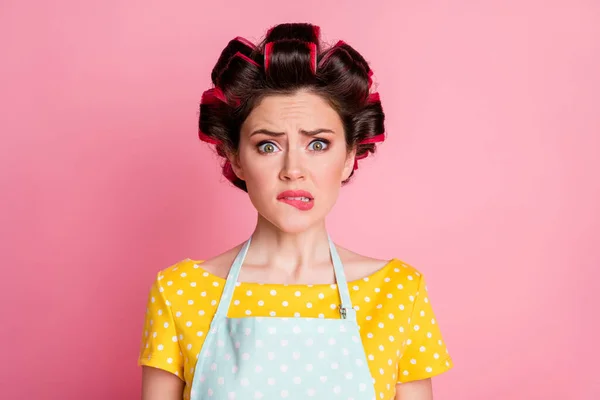 Close-up portrait of her she nice attractive lovely confused scared brown-haired housewife biting lip isolated over pink pastel color background — Stock Photo, Image