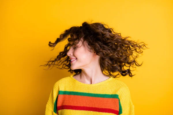 Profile photo of adorable shiny lady wearing casual colorful sweater wind blow hair isolated yellow color background — Stock Photo, Image