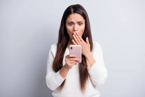 stock image Portrait of lovely focused worried brown-haired girl using device reading bad news comment isolated over grey pastel color background