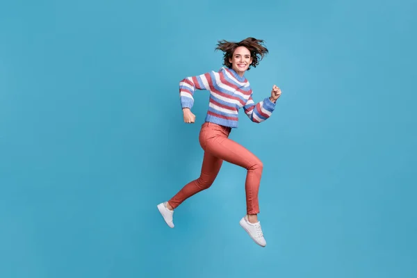 Full length body size side profile photo of jumping high hurrying up funky girl isolated on vibrant blue color background — Stock Photo, Image