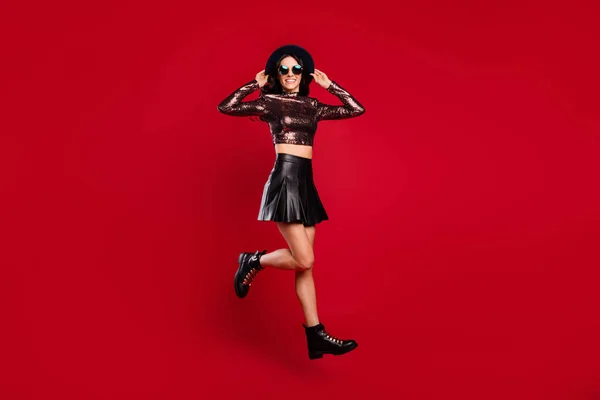 Full body profile side photo of happy nice girl jump up air wear boots isolated on red color background