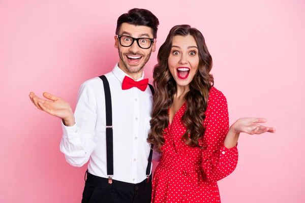 Photo of nice impressed brown hair couple wear trend cloth isolated on pastel pink color background