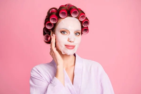 Close up photo of satisfied pretty young lady arm touch facial mask isolated on pastel pink color background — Stock Photo, Image