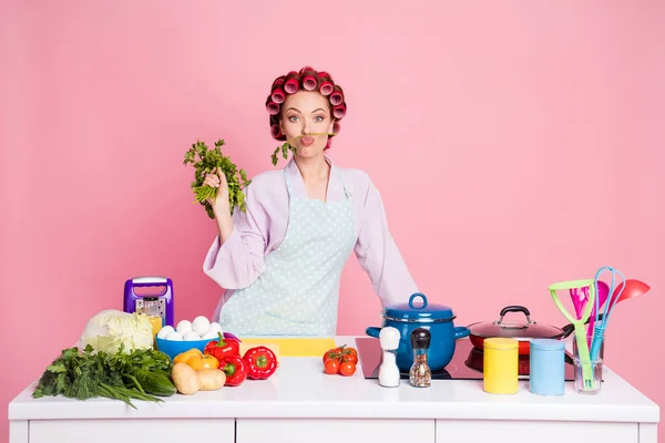 Photo of positive charming lady put vegetable on lips kiss good mood isolated on pastel pink color background