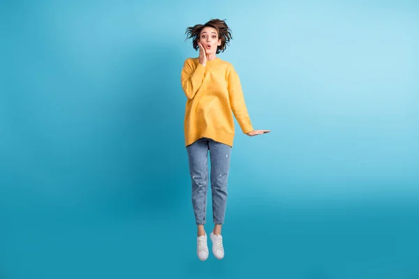 Full length body photo of amazed girl with short hairstyle touching cheekbones isolated on vibrant blue color background — Stock Photo, Image
