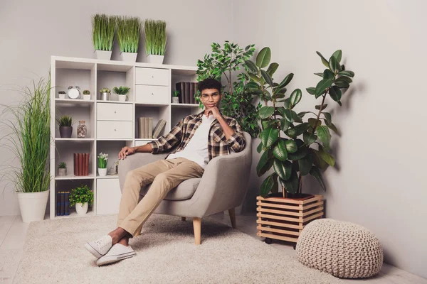 Full length body size photo of confident boy in glasses sitting in armchair freelancer working from home — Stock Photo, Image