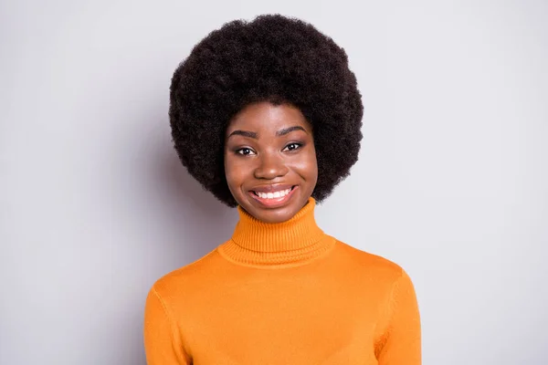 Photo of adorable curly hairstyle dark skin lady smile look camera wear roll neck outfit isolated on grey color background — Stock Photo, Image