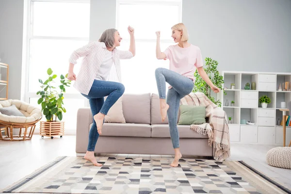 Full body profile side photo of happy women family dance winner good mood smile indoors inside house home — Stock fotografie