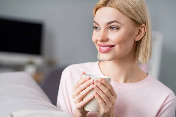 Photo of happy charming dreamy lady look away hold cup of coffee smile indoors inside house home apartment — Stock Photo, Image