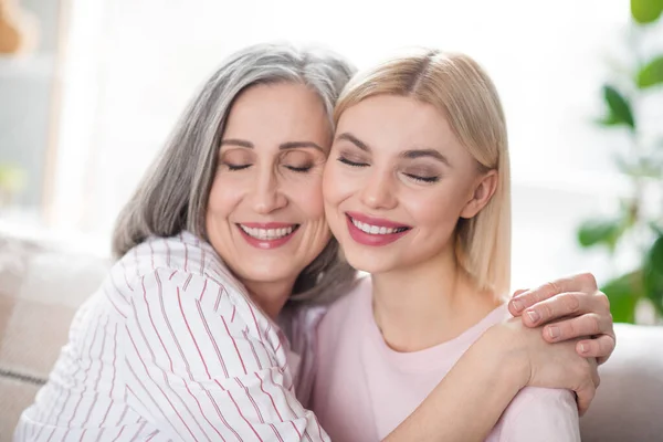 Photo of attractive happy nice family mother and young woman smile hug cheeks smile indoors inside house — Stock Photo, Image