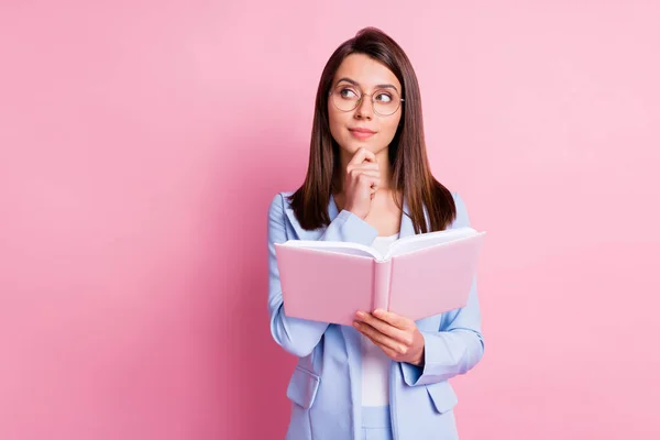 Photo of young girl hold notebook book dreamy think thoughtful look empty space isolated over pastel color background — Stock Photo, Image