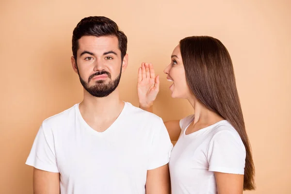 Photo of charming funny husband wife wear white t-shirts making announcement arm ear isolated beige color background — Stock Photo, Image