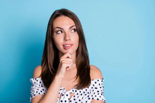 Foto de elegante encantadora chica dedo barbilla mirada espacio vacío mordedura labio desgaste punteado blusa aislado color azul fondo —  Fotos de Stock