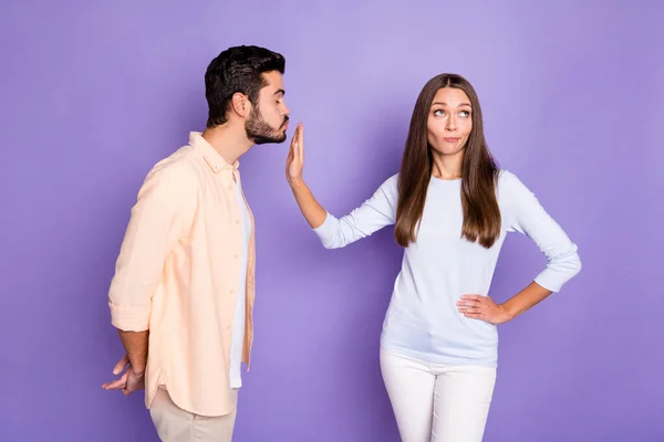 Photo of brunette people man send air kiss woman refuse hand waist ignore isolated on purple color background — Stock Photo, Image