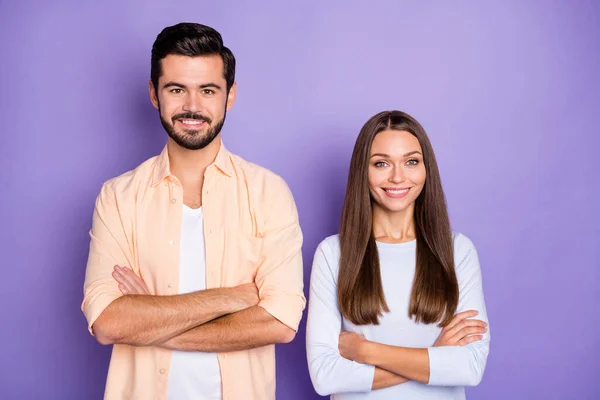 Photo of happy joyful man and woman folded hands cheerful smile good mood isolated on violet color background — Stock Photo, Image