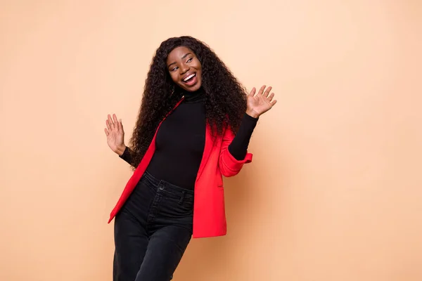 Photo of funky happy dark skin lady look empty space dance smile isolated on pastel beige color background — Stock Photo, Image