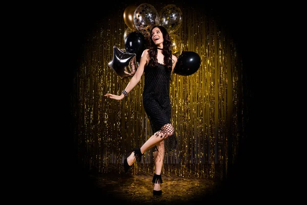 Photo of sweet pretty young lady wear glamour dress dancing holding balloons isolated glitter backdrop background — Stock Photo, Image
