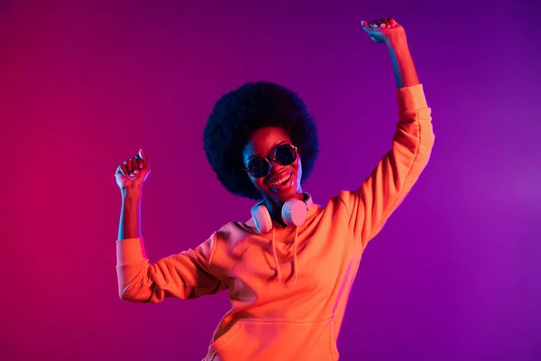 Photo of carefree lady dance have fun wear sweatshirt headphones sunglass isolated gradient dark background — Stock Photo, Image