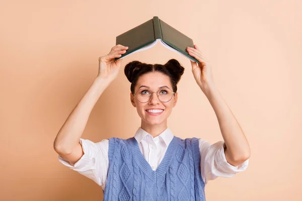 Photo of brunette optimistic lady read book hands up wear spectacles white shirt blue vest isolated on beige color background — Stock Photo, Image