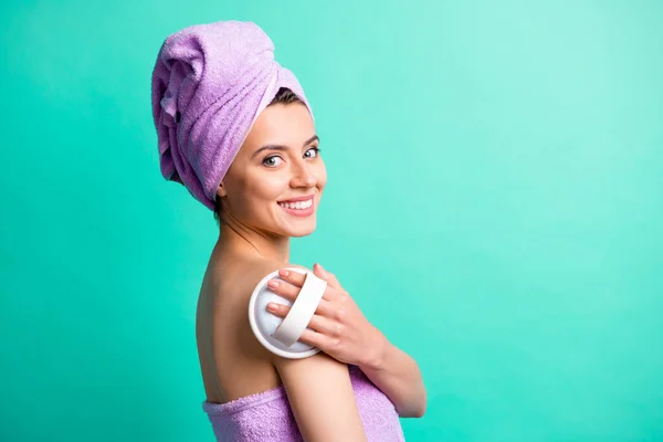 Profile photo of tender relaxed girl hold massage brush toothy smile wear violet towel turban isolated teal color background — Stock Photo, Image