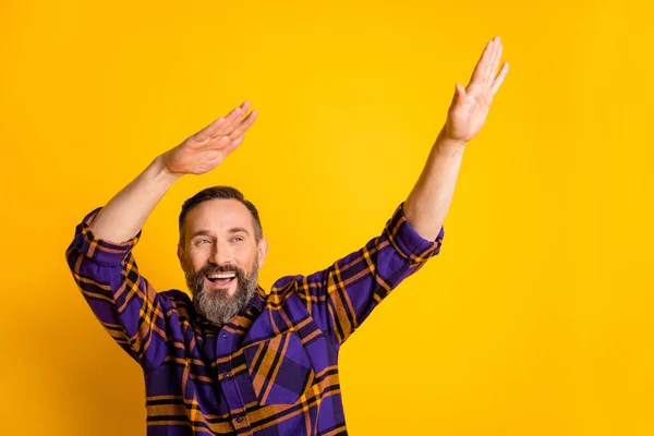 Photo portrait of aged man dancing hip-hop at party laughing looking copyspace isolated on vibrant yellow color background — Stock Photo, Image