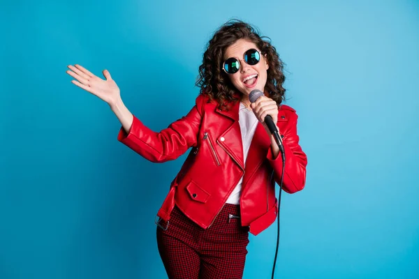 Portrait of funny wavy hairdo excited lady singing hand to side have great weekend isolated on pastel blue color background — Stock Photo, Image