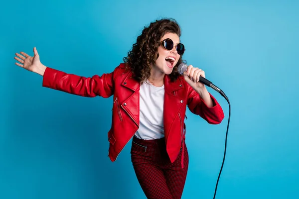 Photo of funny curly hairstyle young girl sing open mouth wear round sunglass good mood isolated on blue color background — Stock Photo, Image