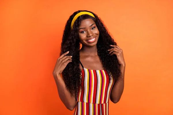 Photo of attractive charming dark skin woman wear yellow headband smile isolated on orange color background — Stock Photo, Image