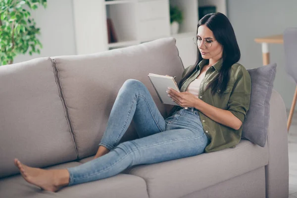 Full length body view of lovely focused girl lying on divan bare foot writing story review plan at home house flat indoor — Stock Photo, Image