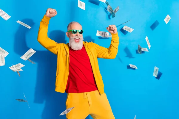 Photo of happy excited crazy good mood mature man raise fists in victory win lottery money isolated on blue color background — Stock Photo, Image