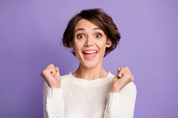 Photo of impressed nice hairdo lady fists up open mouth unexpected result isolated on violet color background — Stock Photo, Image