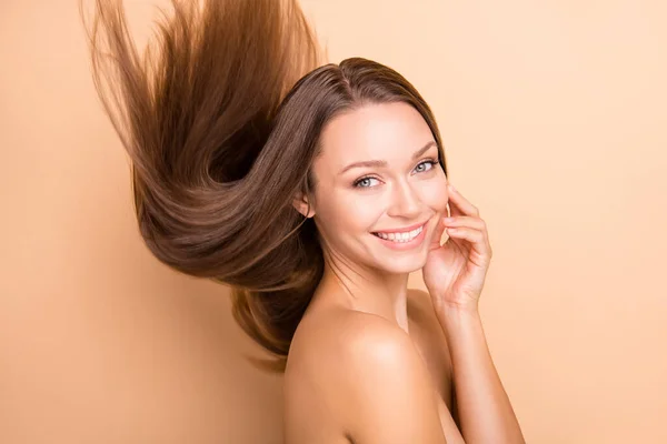 Profile photo of pretty lady hand touch cheek hair flying no clothing isolated on beige color background