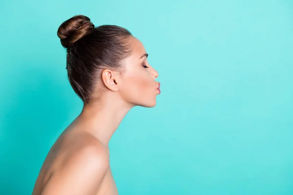 Profile side view portrait of attractive amorous girl fresh clear skin sending air kiss copy space isolated over bright teal turquoise color background — Stock Photo, Image