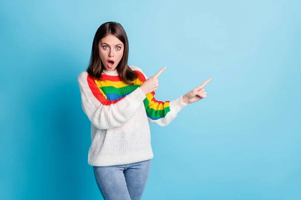 Portrait of shocked pretty person open mouth direct two hands fingers empty space isolated on blue color background — Stock Photo, Image