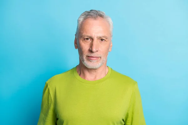 Portrait of attractive serious content bearded grey-haired guy isolated over bright blue color background — Stock Photo, Image