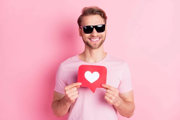 Photo of positive person hands fingers hold paper like card beaming smile isolated on pink color background — Stock Photo, Image