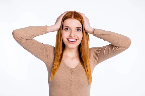 Photo of charming excited redhair woman beige shirt arms head open mouth smiling isolated white color background — Stock fotografie