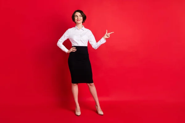 Full length body size photo curious business woman showing finger copyspace isolated vibrant red color background — kuvapankkivalokuva