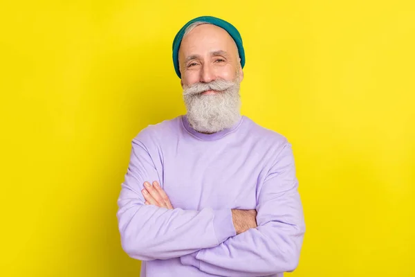Photo portrait of aged man smiling cheerful nice with folded hands isolated vibrant yellow color background — Stock Photo, Image